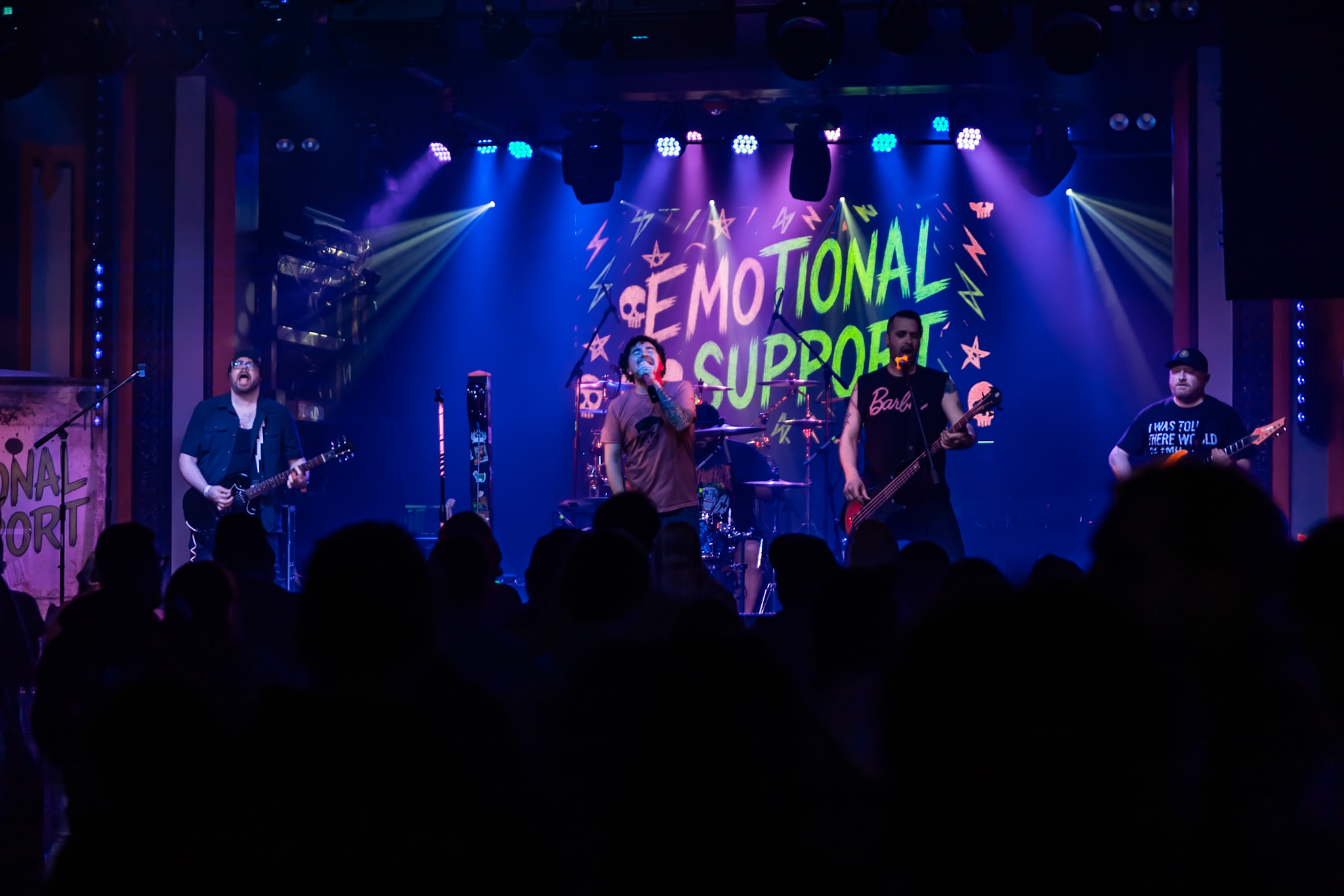 EMOtional Support performing to a packed crowd