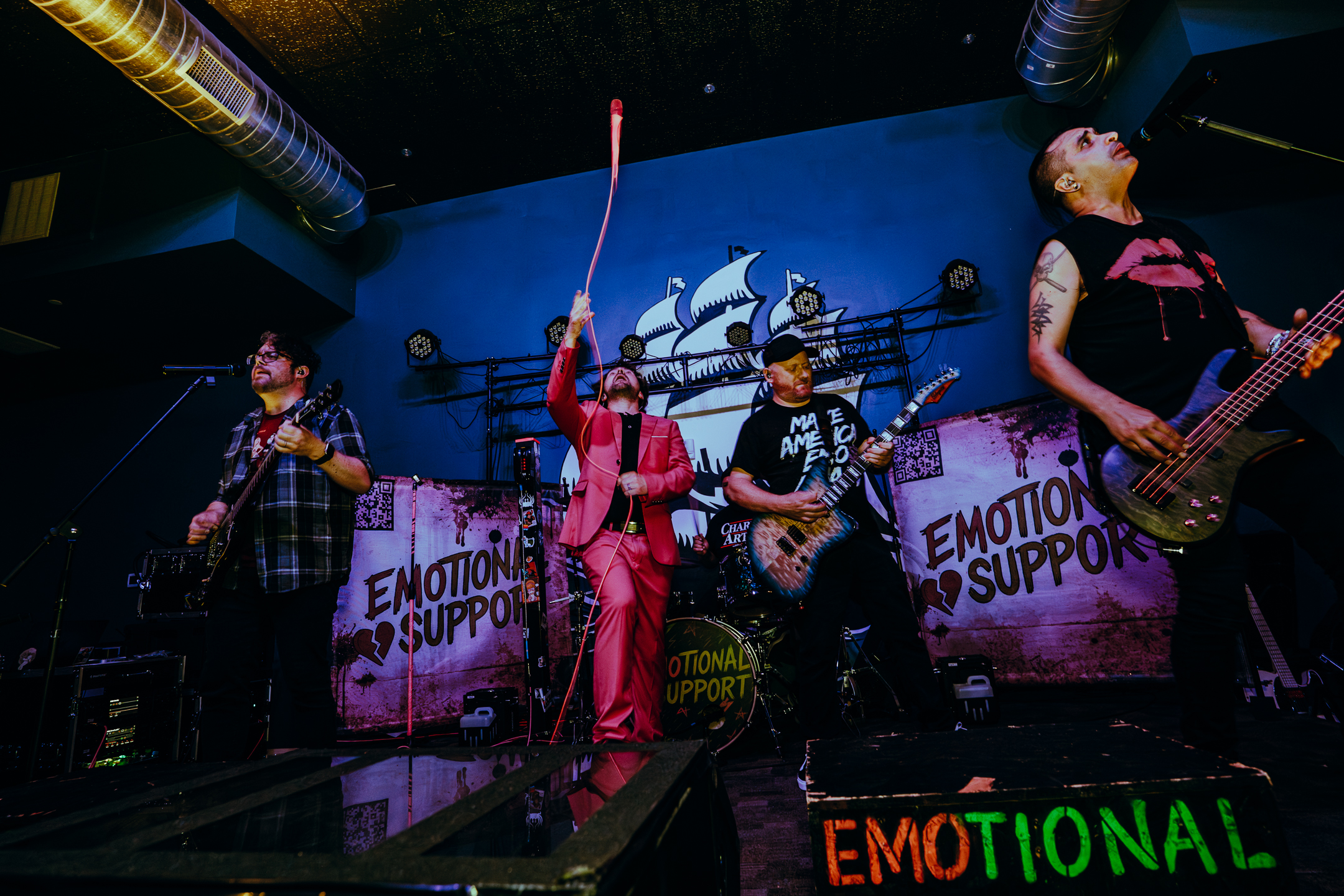 EMOtional Support performing to a packed crowd